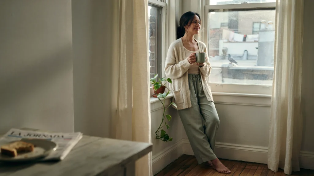 A woman pausing to reflect on what she wants — the first step in using her permission slip.
